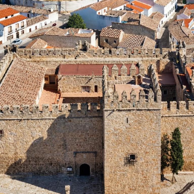 an aerial view of a building in a city at Castillo de Orgaz gratis la entrada y cerca del Puy du Fou hoy! in Manzaneque