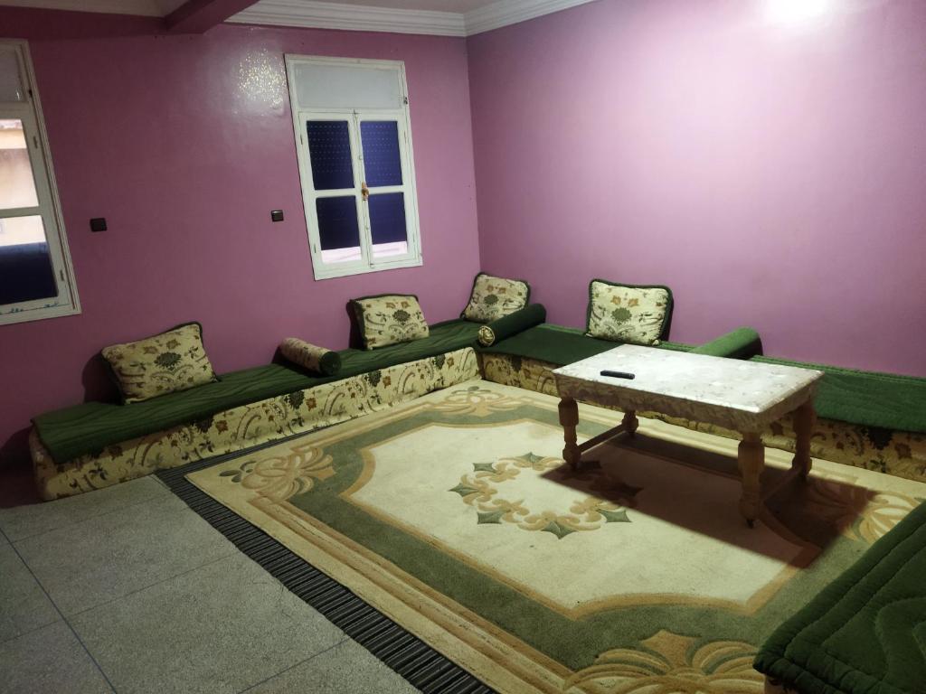 a living room with a couch and a table at شقق الخيالي 1 in Tan-Tan