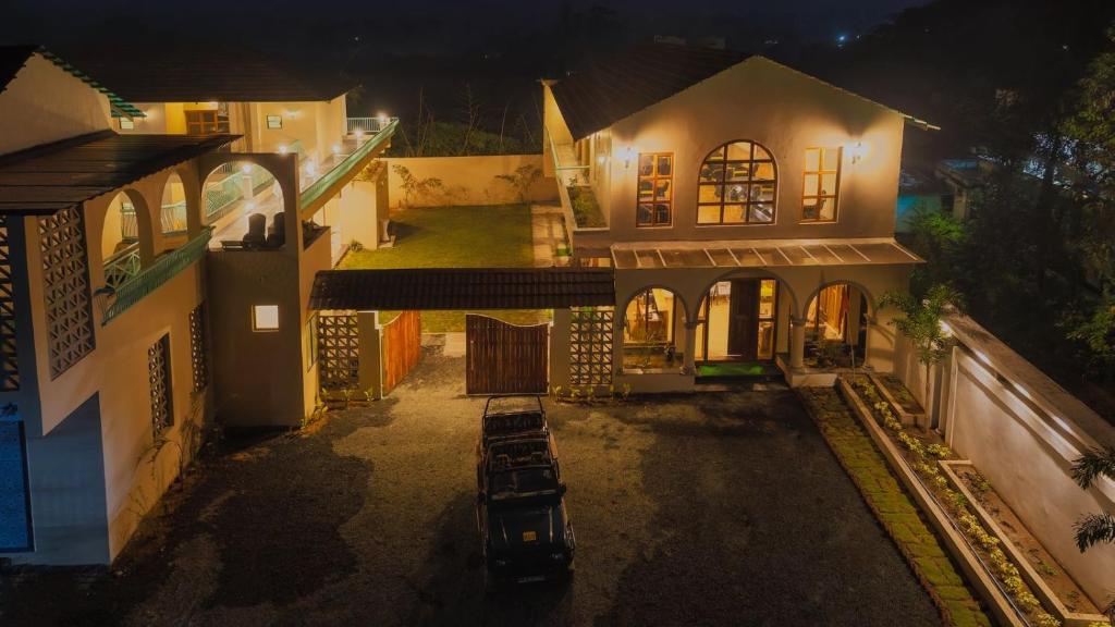 an aerial view of a house at night at The Bagh Villa Pench By Ficusroots Experience in Khawāsa