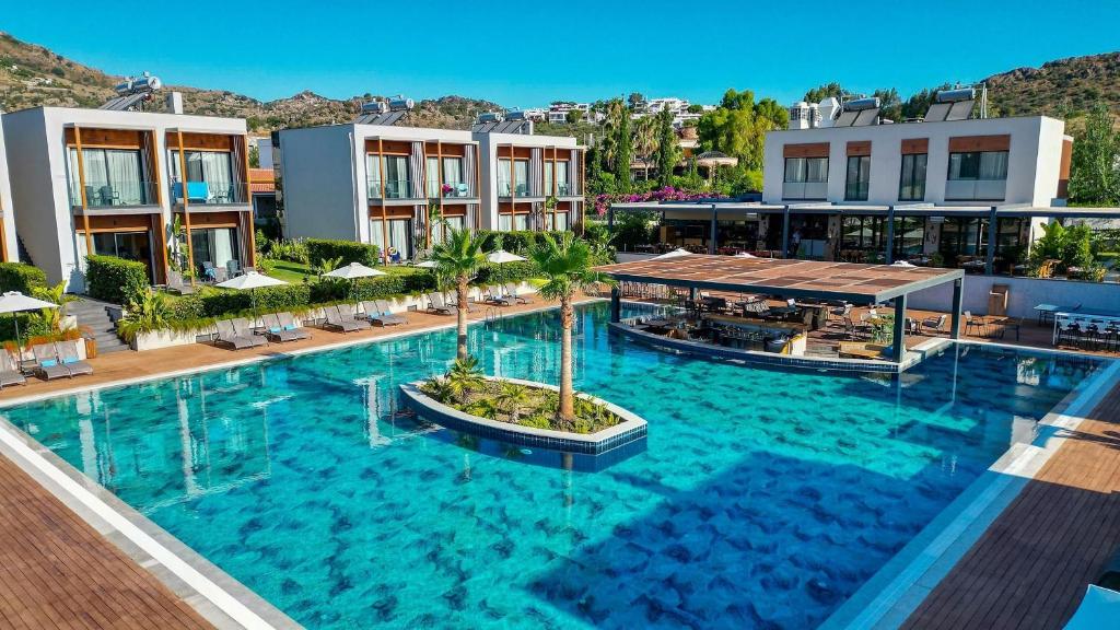 an overhead view of a large swimming pool at a resort at Celeste Bella Luxury Hotel & Spa in Bodrum City