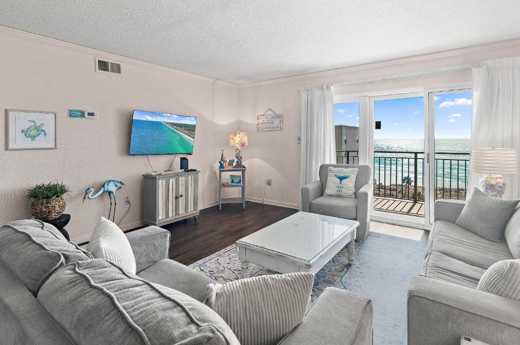 a living room with a view of the ocean at Emerald Isle 708 in Fort Walton Beach
