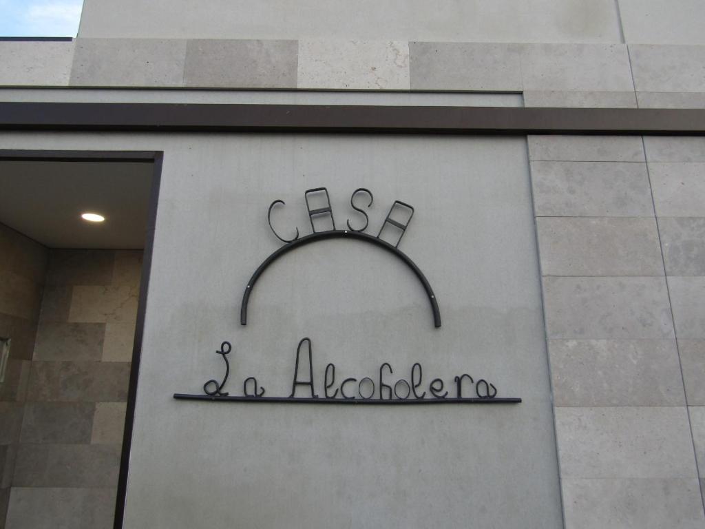 a sign on the side of a building at La Alcoholera in Valtierra