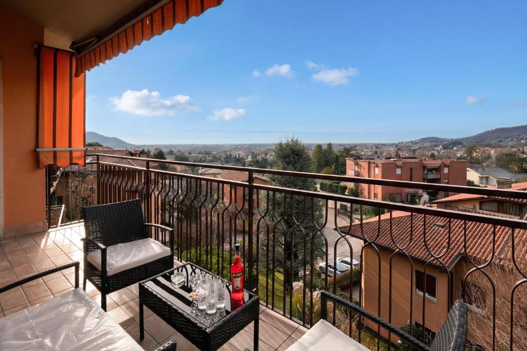 a balcony with a chair and a table at Viewpoint House in Alzano Lombardo