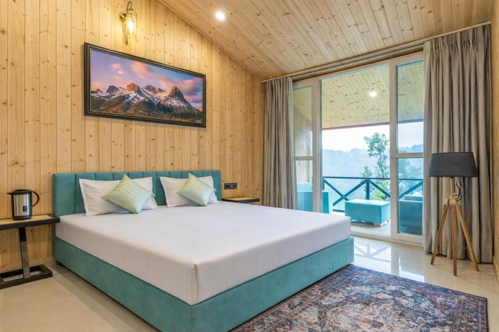 a bedroom with a bed and a large window at River and Roots Resort, Riverside Boutique Stay , Bonfire, Scenic Views in Dehradun