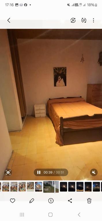 a bedroom with a large bed in a room at Rafa y Nelly 2 in San Clemente del Tuyú