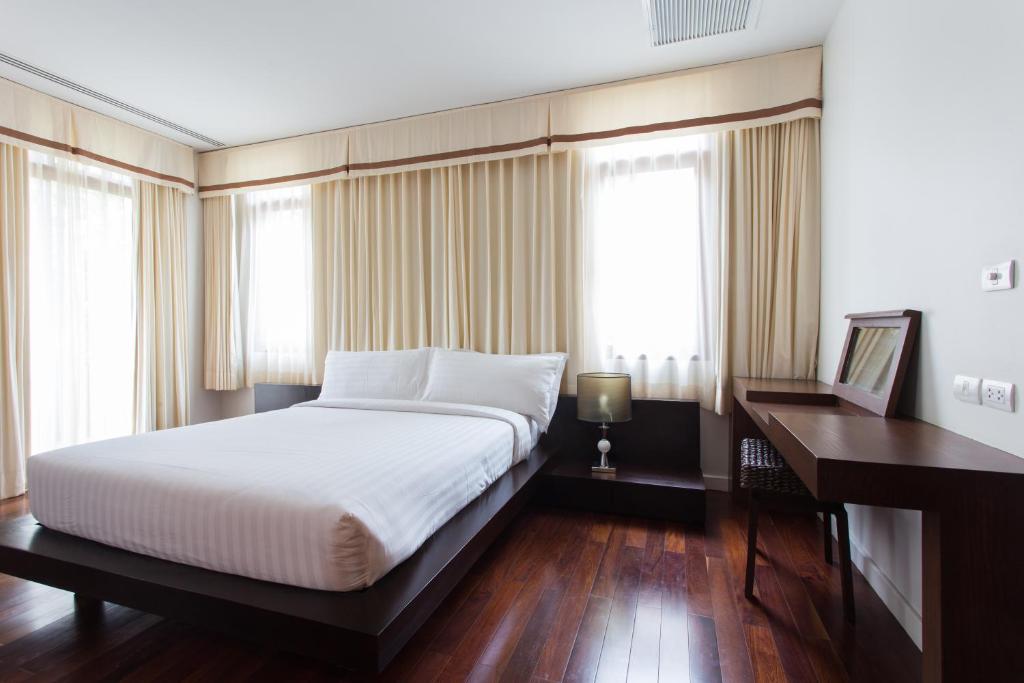 Postel nebo postele na pokoji v ubytování Amatapura Beachfront Villa 10 , SHA Certified