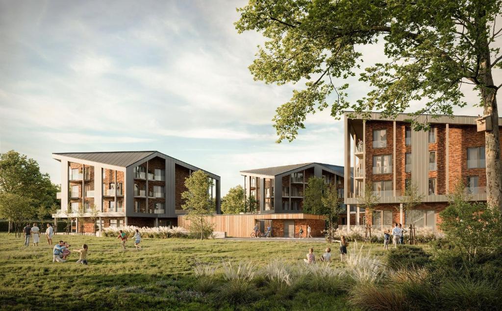 a rendering of two buildings with people in a field at Ferienwohnung TheViewB17 Boje 17 Dagebüll in Dagebüll