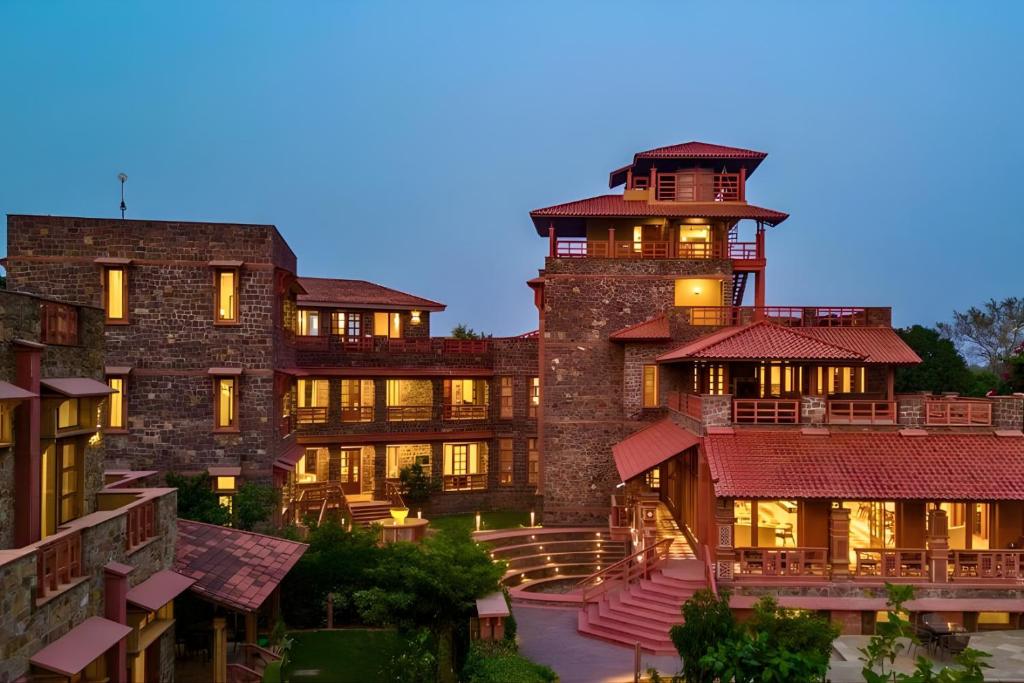 a large building with two towers on top of it at Seraibagh Ranthmabore in Khilchipur
