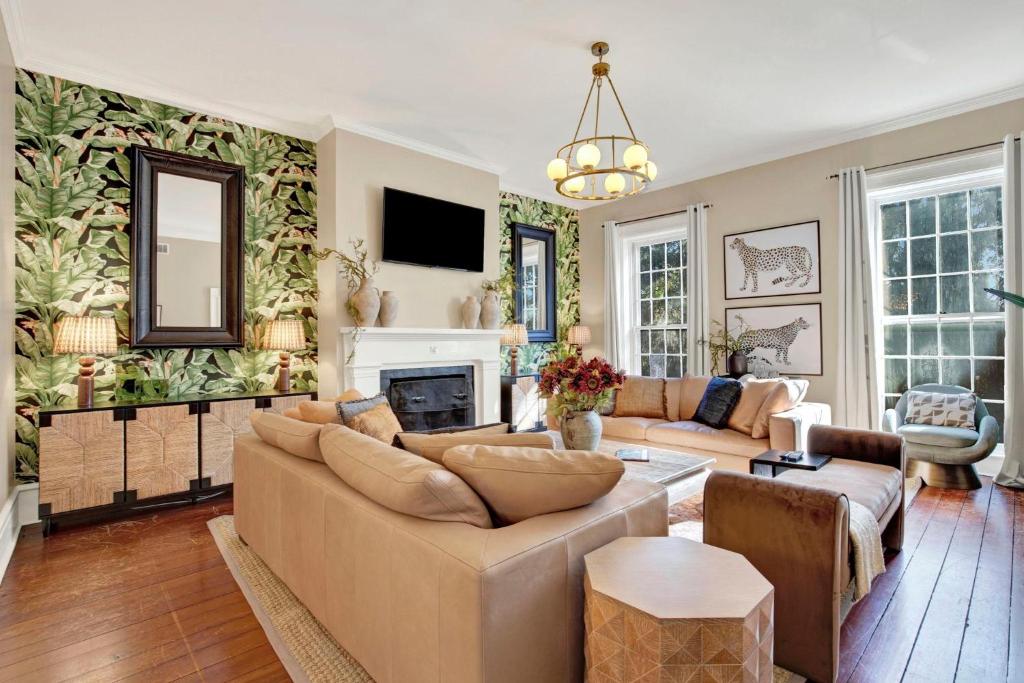 a living room with a couch and a fireplace at Oglethorpe Estate in Savannah