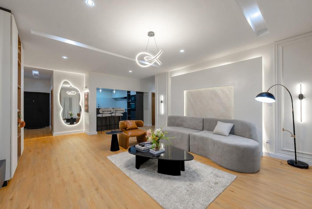 a living room with a couch and a table at The Zenith Palace in Lekki