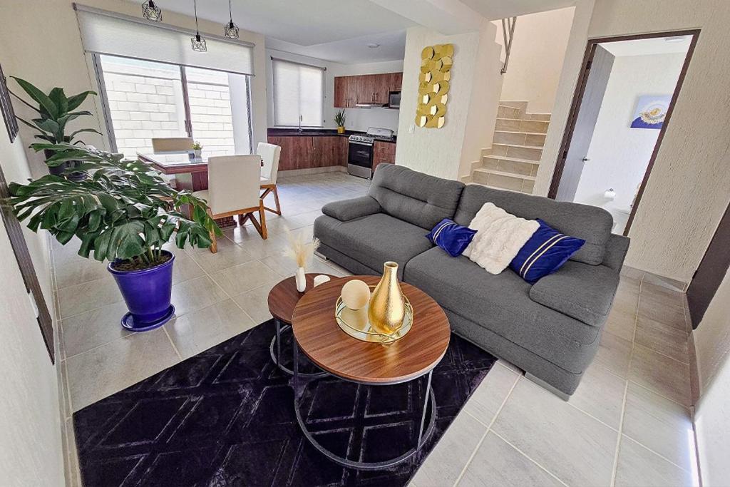 a living room with a couch and a table at Casa Brianzzas in Miranda