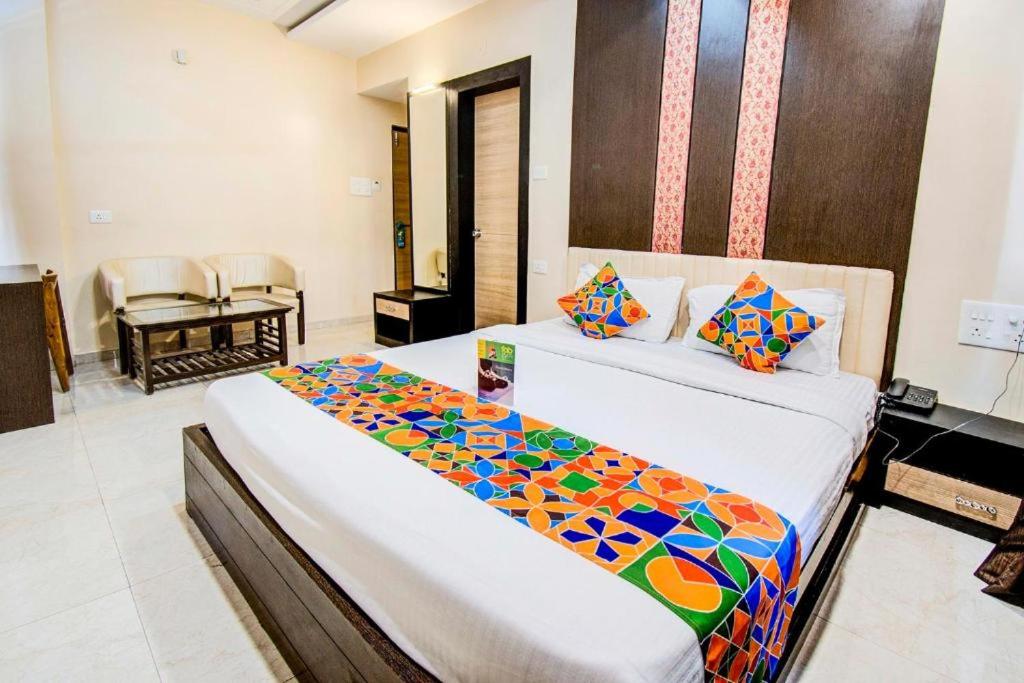 a hotel room with two beds in a room at Hotel Krishna Inn in Bhiwandi