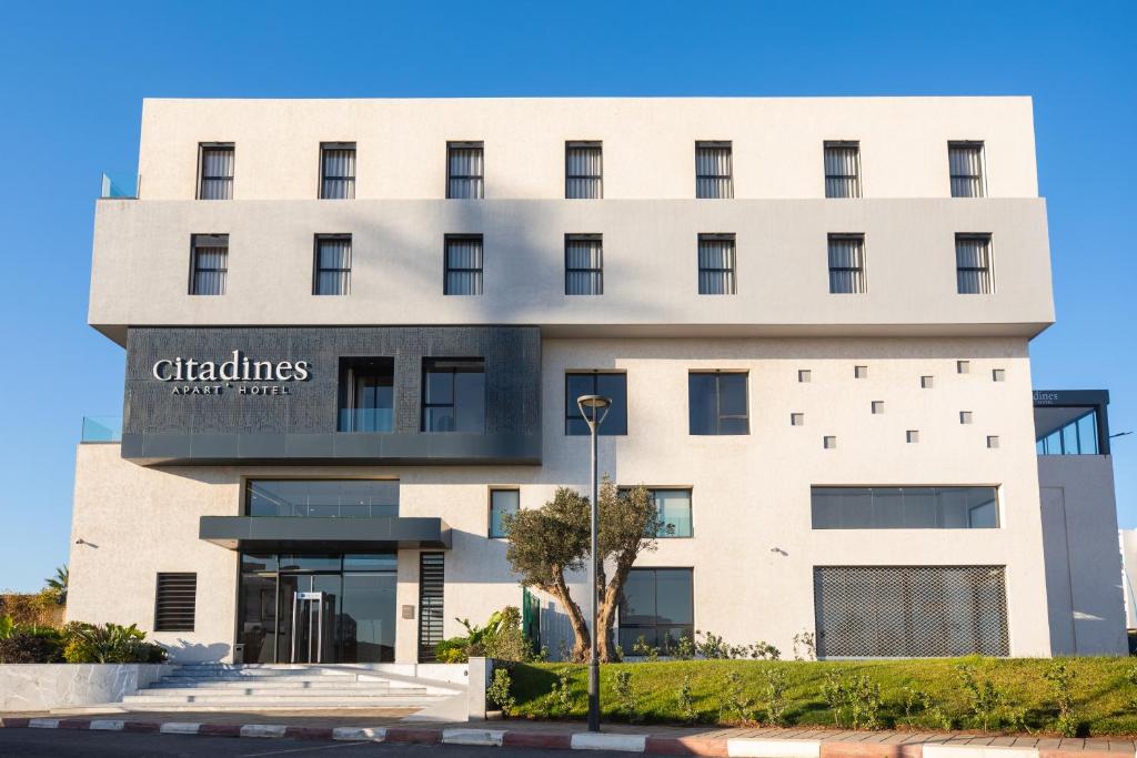 a building with a sign that reads chatesart hotel at Citadines Almaz Aparthotel Casablanca in Casablanca