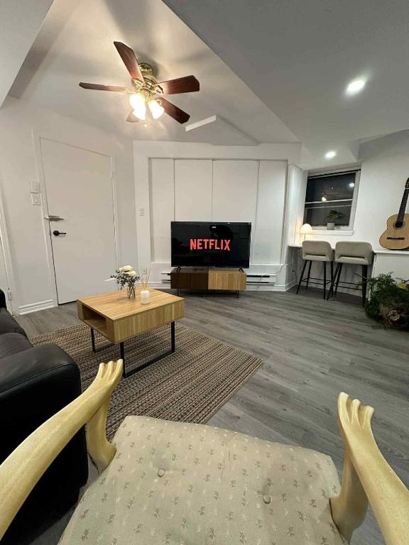 a living room with a couch and a ceiling fan at Lovely apartment for rent in Vitry-sur-Seine