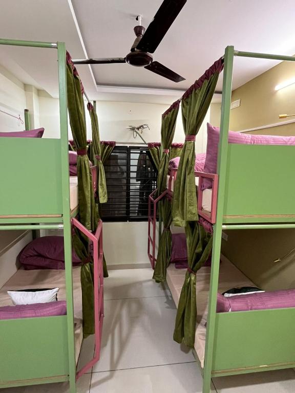 a group of bunk beds in a room at ReneeMysa in Indore