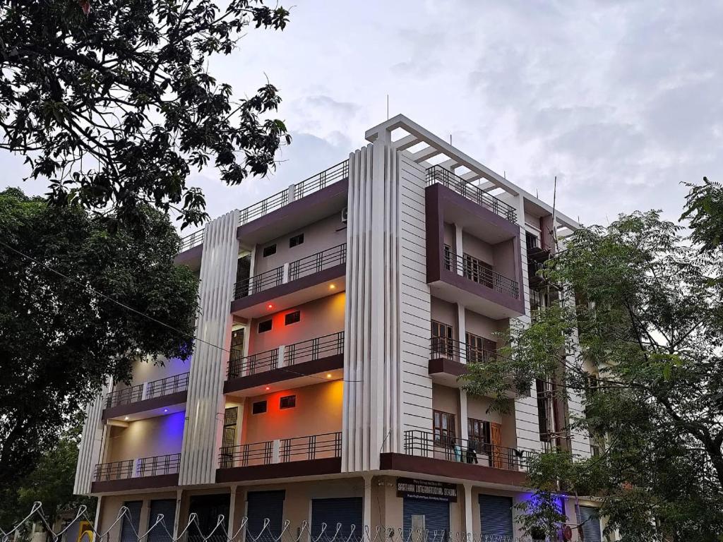 a tall building with lights on the side of it at Royal Rudraksh Palace in Bābatpur