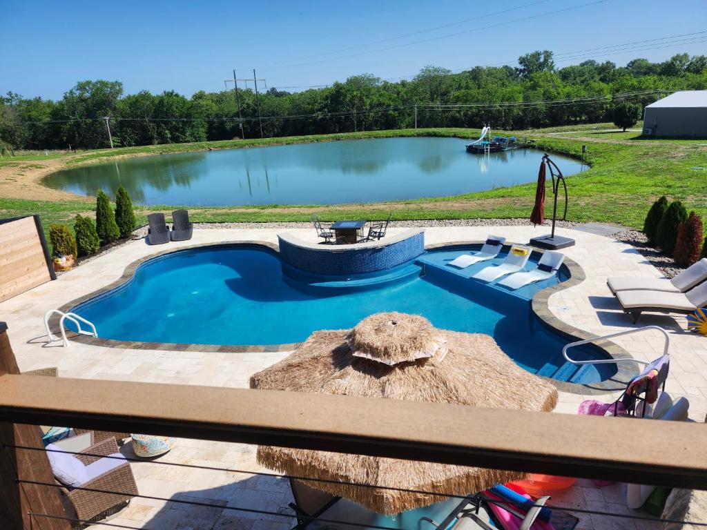 a large swimming pool with chairs around it at Country Resort in Bates City
