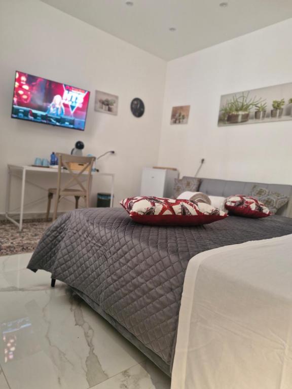 a bedroom with a bed with two pillows on it at Dolce Giò A in Mazara del Vallo