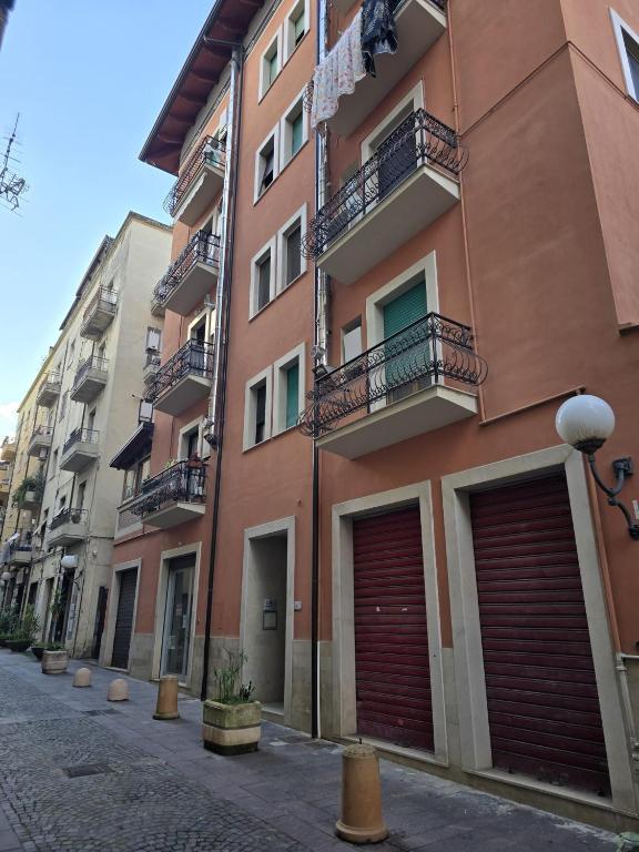 a building with two garage doors on a street at Bis Jolly 1 in Cosenza