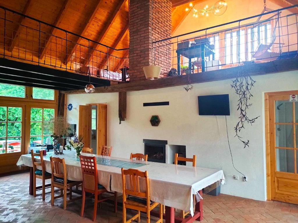 a large dining room with a table and chairs at WERK 2 - B&B Ecoturistic - Saschiz in Saschiz