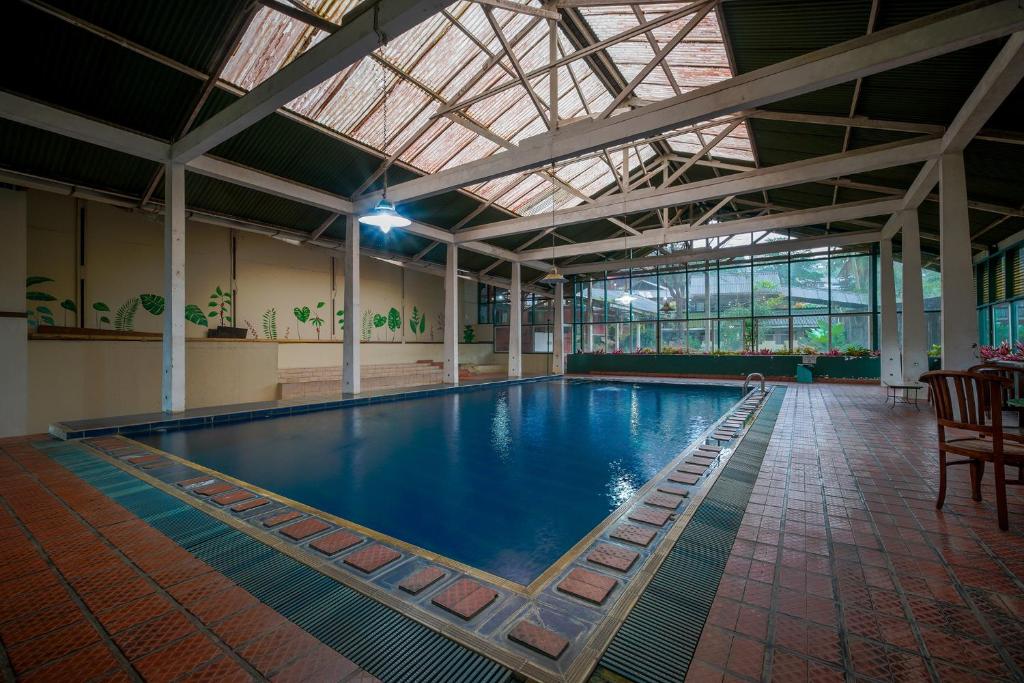 a large indoor pool with a large ceiling at Griya Astoeti By ARBA in Kopo 2