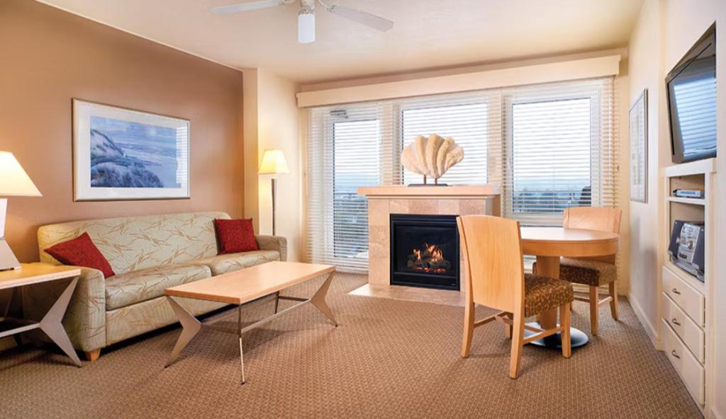a living room with a couch and a fireplace at WorldMark by Wyndham Seaside OR in Seaside