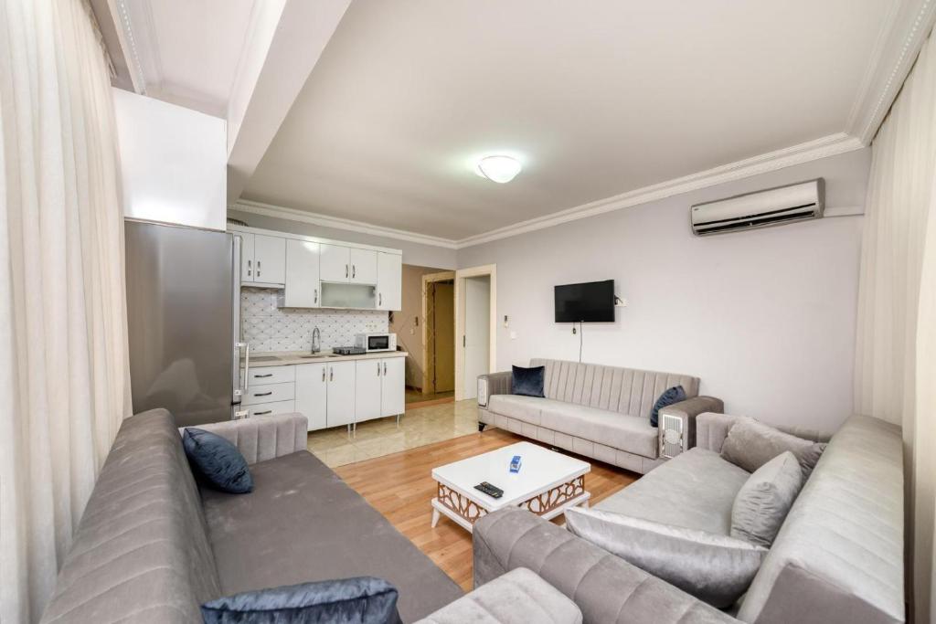 a living room with a couch and a table at İstanbul Amoria Guest House in Istanbul