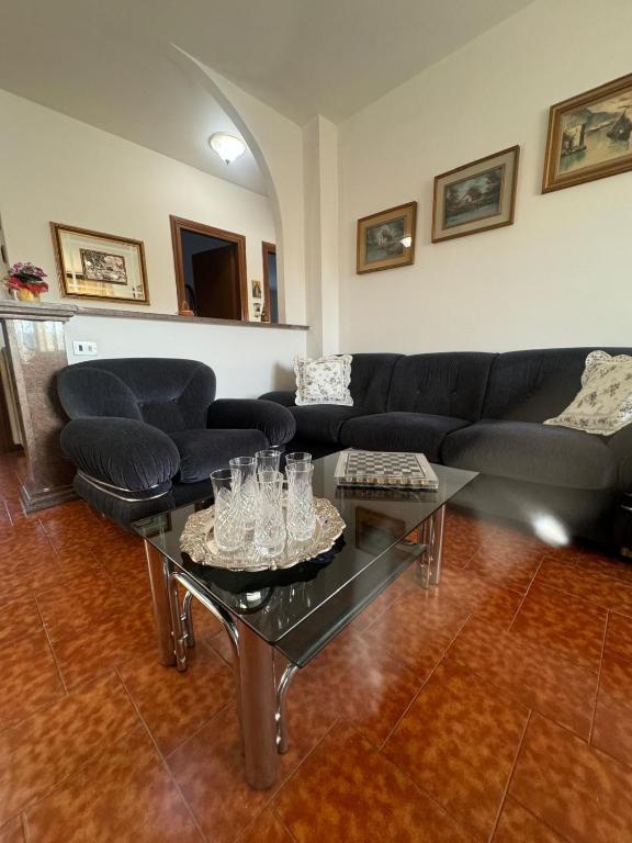 a living room with a couch and a table at Casa di Anna in Graffignano
