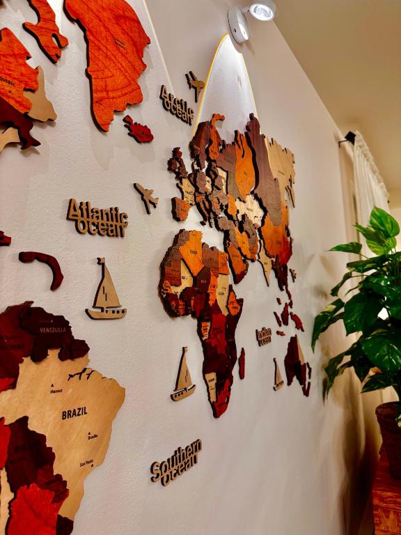 a wall with a map of the world on it at Ocean View Home Nanaimo in Nanaimo