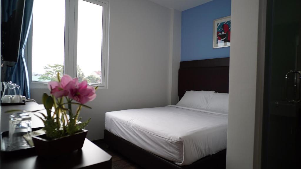 Postel nebo postele na pokoji v ubytování Hotel Cascada
