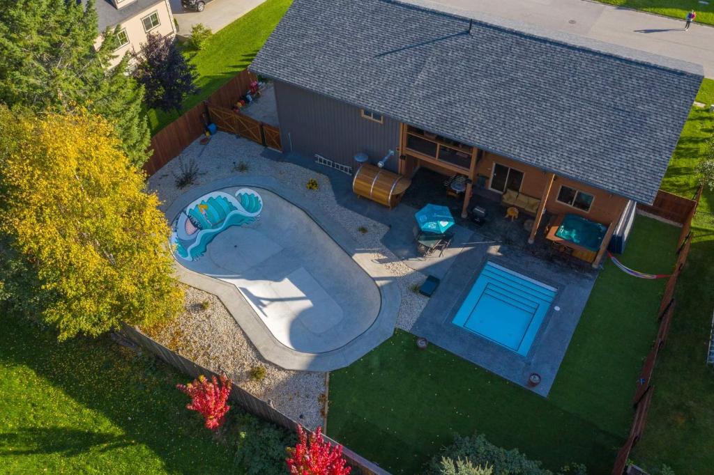 an overhead view of a house with a swimming pool at Big Bear Chalet and spa in Revelstoke