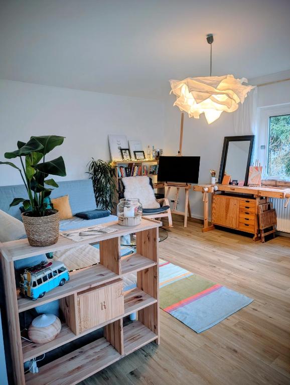 a living room with a couch and a table at Basislager Rheinsteig in Bad Hönningen