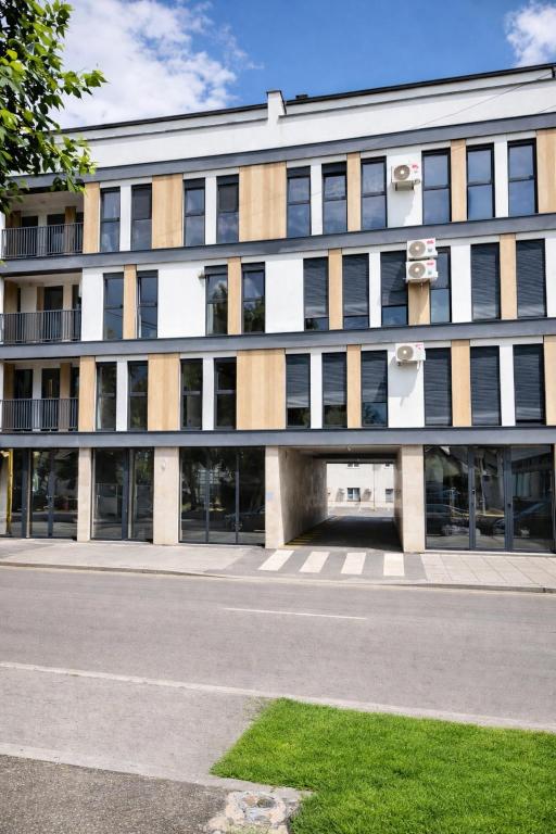 a large building with a lot of windows at Lana Apartmani Autor in Tuzla