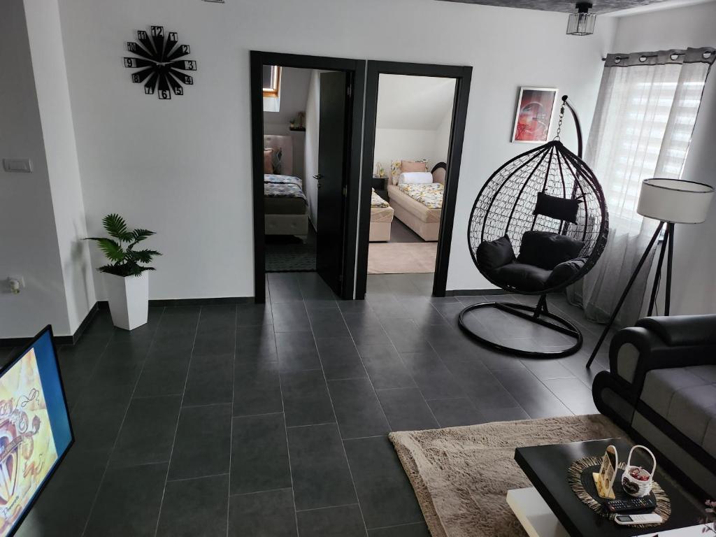 a living room with a couch and a chair at Crassula Lux 2 in Surčin
