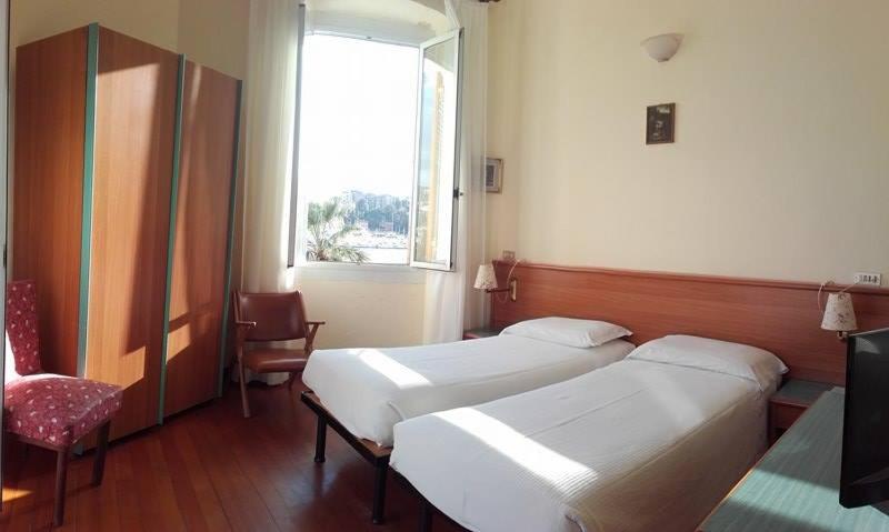 Postel nebo postele na pokoji v ubytování Albergo Bandoni