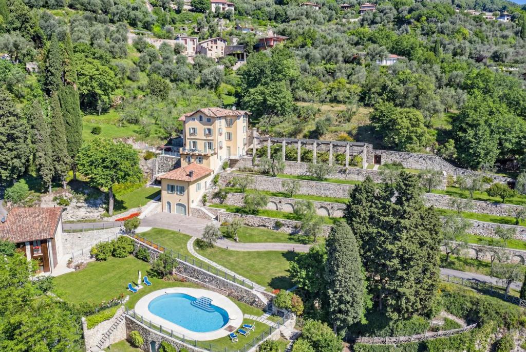 an aerial view of an estate with a swimming pool at Limonaia dei Dogi Entire 7BR Villa with Private Pool & Lake Garda View in Gargnano