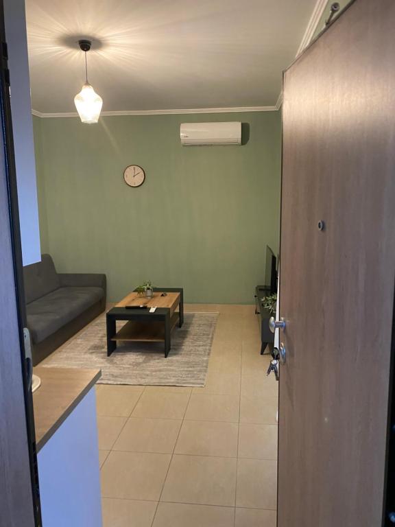 a living room with a table and a couch at Christina Apartment 2 in Drama