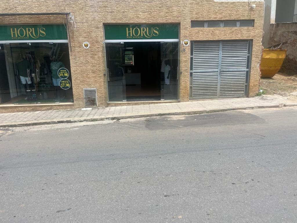 an empty street in front of a store at MGerais Pousada in Visconde do Rio Branco