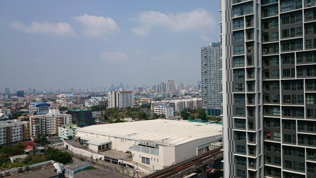 an aerial view of a city with a building at Sukhumvit 81 Condo - A in Bangkok