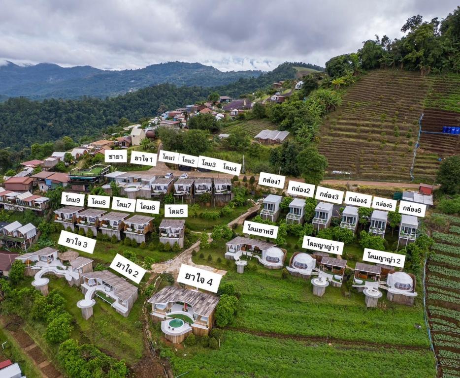 an aerial view of a village on a hill at Monsaan ม่อนซาน in Mon Jam