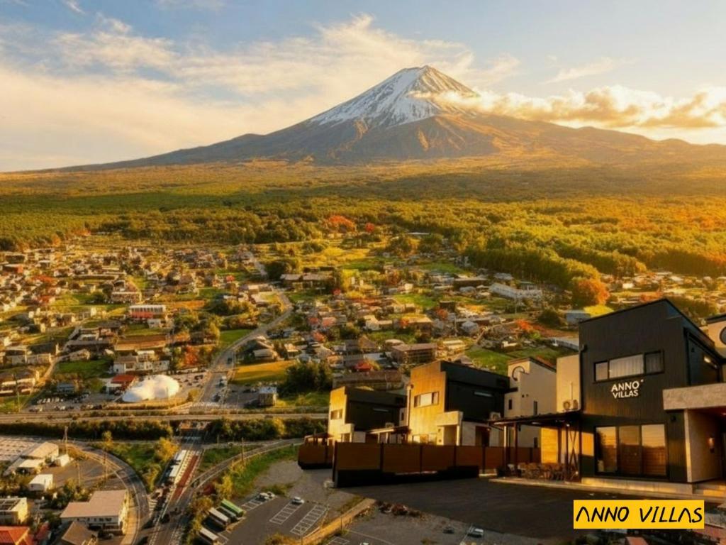 a view of a city with a mountain in the background at Sankando Villa Hotel in Fujikawaguchiko
