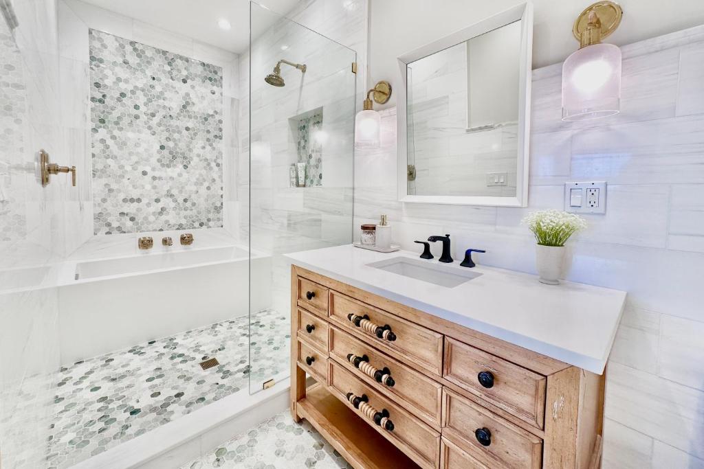 a white bathroom with a sink and a shower at FO13 Dreamcatcher in Frisco