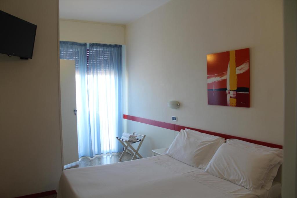 Postel nebo postele na pokoji v ubytování Hotel Universal