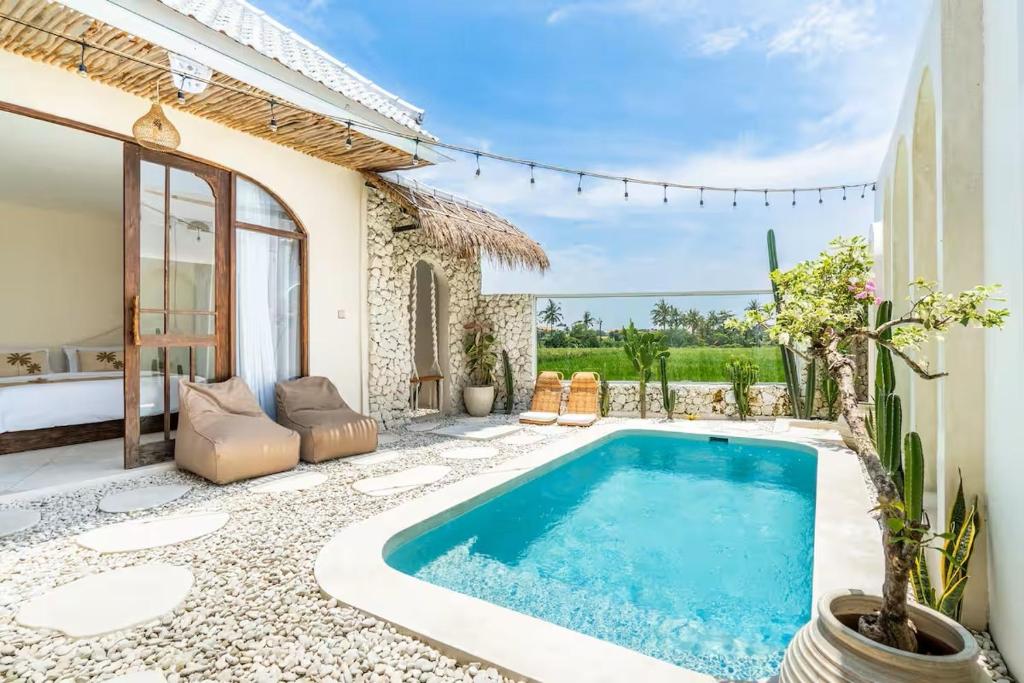 a pool in the backyard of a villa at Villa Wedas in Canggu