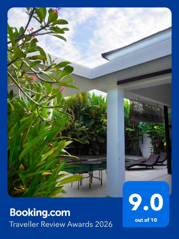 a view of a conservatory with a house with a roof at Tranquil 2BR Pool Villa - Fast WiFi - Work-Friendly - Near Echo Beach in Tumbak Bayuh