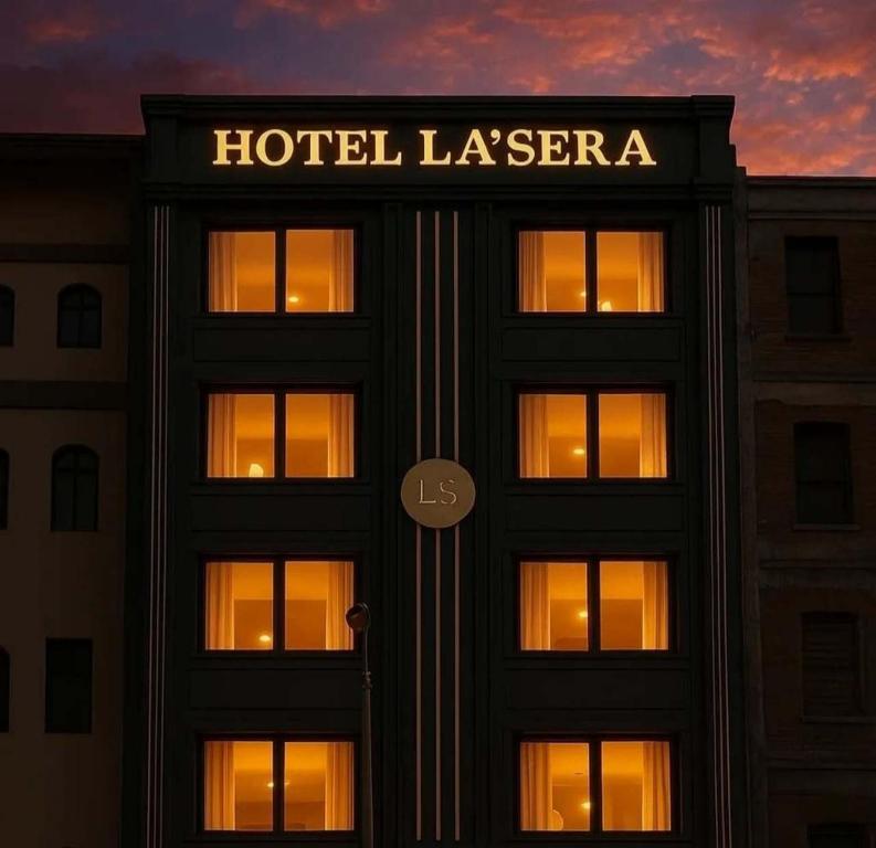 a building with a hotel la serra sign on it at Hotel La Sera in Srinagar
