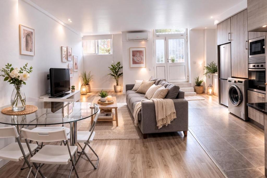 a living room with a couch and a table at Zena Park - Near Lisbon in Odivelas