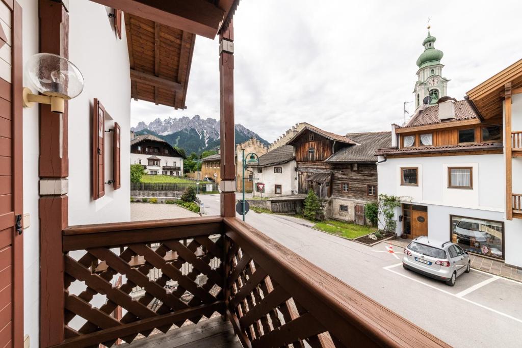 a balcony with a view of the mountains at Villa Santer in Dobbiaco