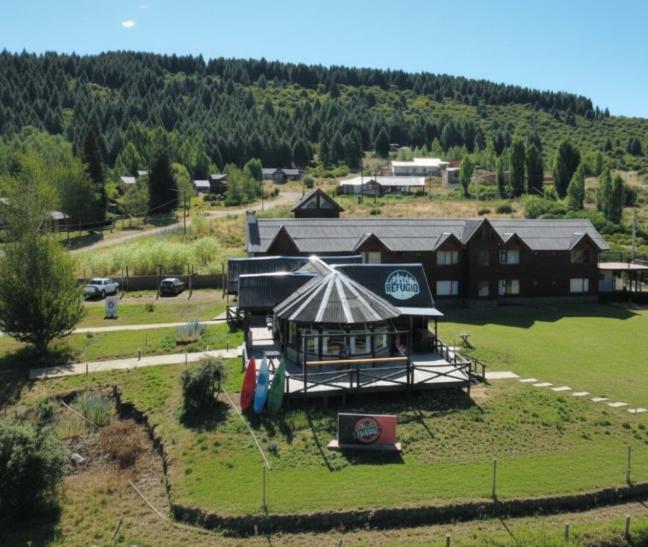 an aerial view of a resort with a building at Hosteria EL REFUGIO in Aluminé