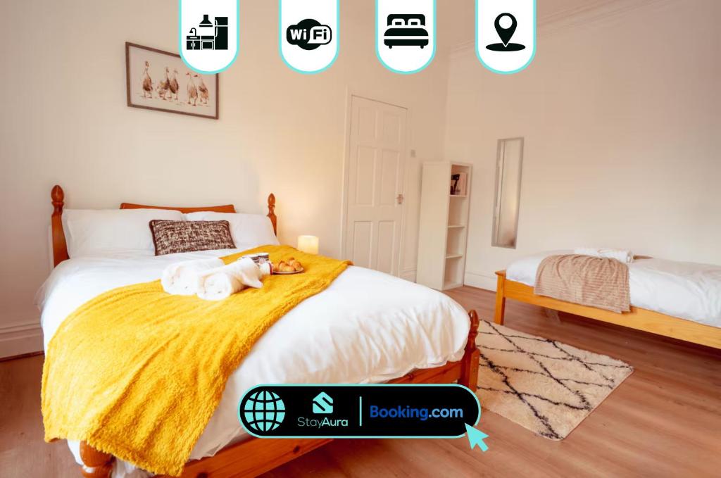 a bedroom with a bed with a stuffed animal on it at Beautiful 3 Bed, Free Parking & Sleeps 9 By Stay Aura Holiday Lets Gateshead in Gateshead